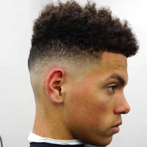 rizos largos en top con low bald fade