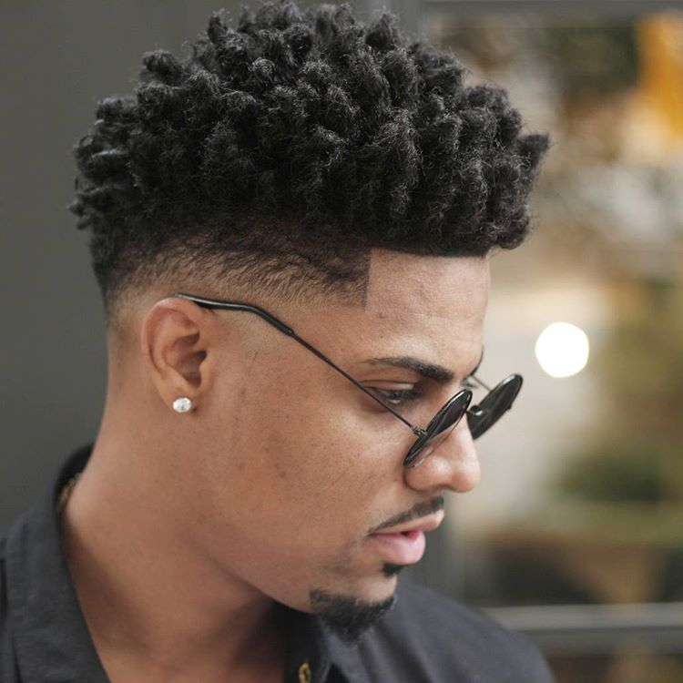 Twisted curls on top, shape up, and low bald fade