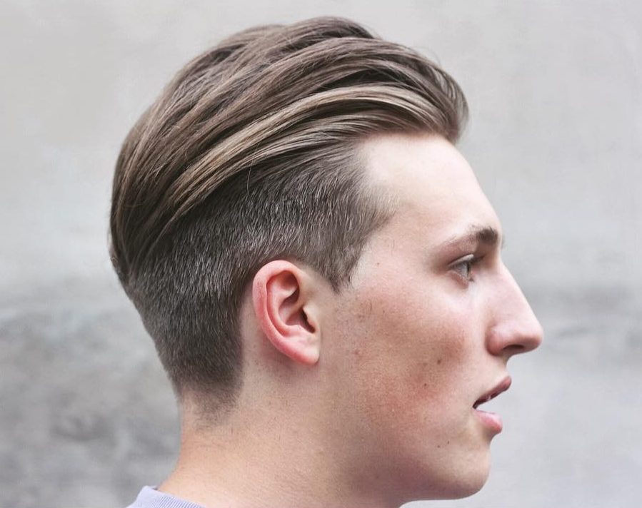Slicked back modern undercut hairstyle for men