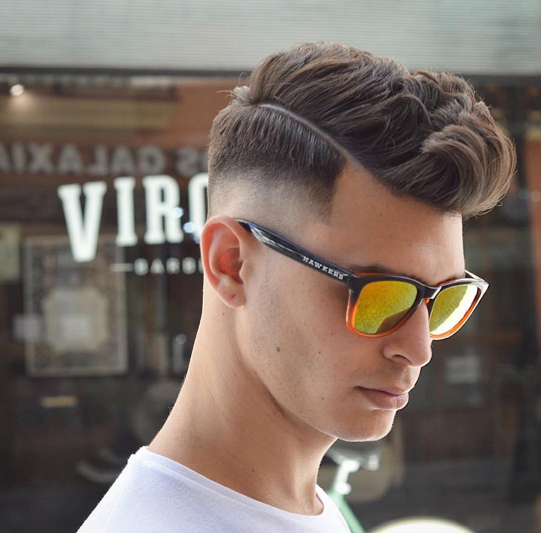 Cool mens haircut for thick hair with mid fade and side part